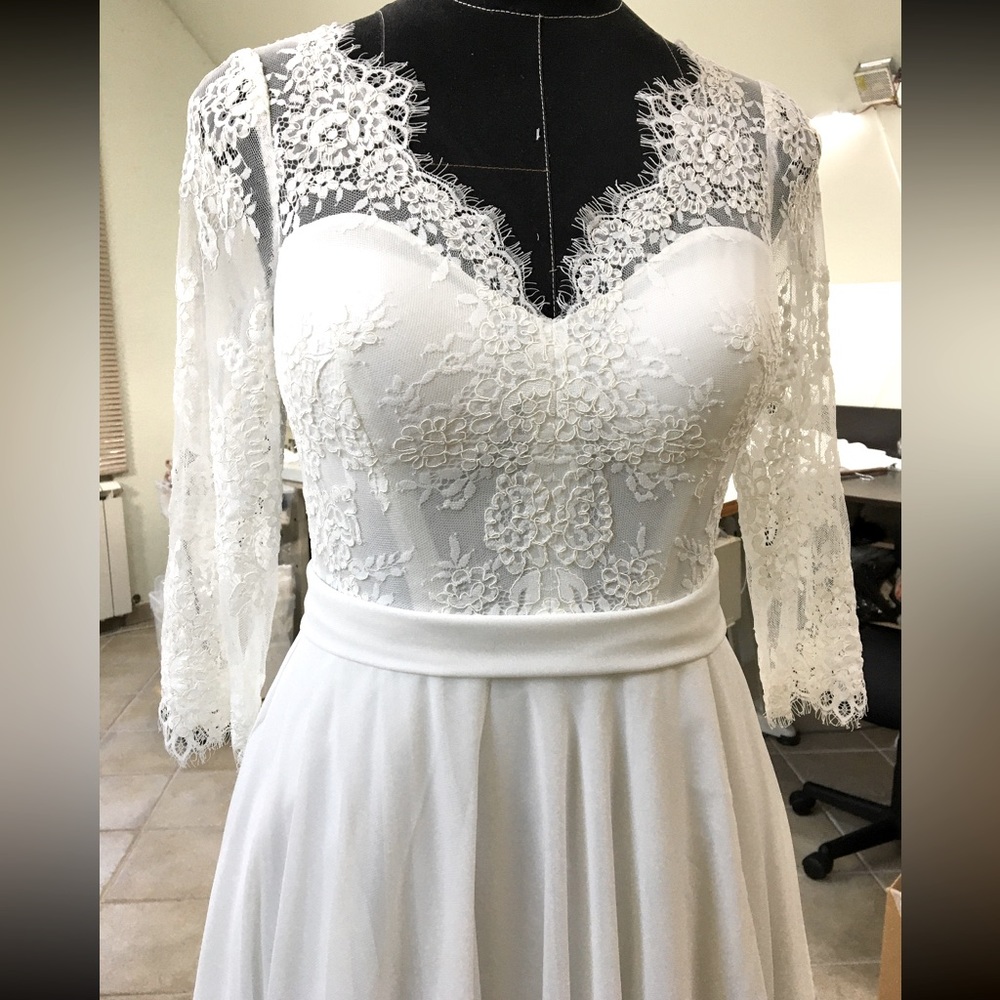 Beautiful chiffon and lace A-line floor length white wedding dress
